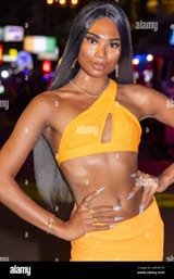 sexy-thai-ladyboy-posing-in-revealing-outfit-at-night-pattaya-thailand-2WY0CT9[1]
