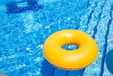 swimming-pool-yellow-inner-tube-i-pool-picture-id1170062615-2346691389