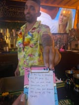 guy-handing-note-v0-dfpdm1eui0ye1