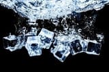 ice-cubes-in-water-on-studio-dark-background-the-concept-of-freshness-with-coolness-from-ice-cubes-photo