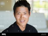 korean-man-smiling-indoors-EB3BFW-2249965762
