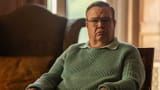 eric-stonestreet-as-al-looking-terse-while-sitting-in-a-chair-in-dexter-resurrection