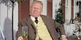 Auric-Goldfinger-enjoys-a-drink-in-Goldfinger