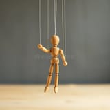 wooden-marionette-puppet-strings-hanging-midair-image-showcases-wooden-marionette-puppet-strings-hanging-350853016