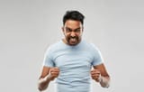 angry-indian-man-screaming-over-grey-background-emotion-anger-people-concept-132925664