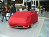 e3-2006---covered-sports-car-in-the-lobby_4690212342_o