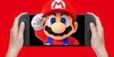 super-mario-holding-his-hat-while-merging-from-hand-held-nintendo-switch-2-on-red-background-2x1-composite