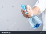 stock-photo-hand-holding-blue-plastic-spray-bottle-contain-pure-water-on-white-background-679543279[1]