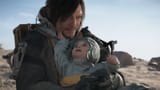 Death-Stranding-2-on-the-beach-trailer-Norman-Reedus-and-a-baby (1)