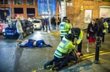 British Man reaching for a beer and not giving a shit