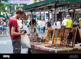 a-tourist-pays-for-some-magical-artifacts-at-a-street-vendor-in-old-ebonheart-morrowind-DW6CYR