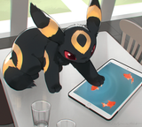 umbreon pawing at fish on an ipad