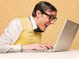 36442487-young-nerd-sitting-at-the-computer