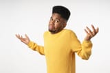 portrait-of-young-confused-man-in-standing-and-shrugging-shoulders-picture-id1223042318-245098209