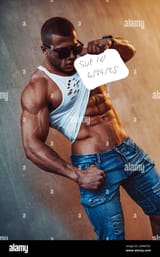 young-strong-man-bodybuilder-on-stone-wall-background-cool-and-warm-lights-effect-2D4MTAC