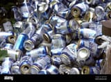 pile-of-empty-busch-beer-cans-in-private-yard-2AFYK3W