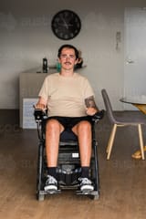 disabled-man-in-motorised-wheelchair-austockphoto-000191212