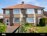 front-view-of-two-1930s-semi-detached-houses-ipswich-suffolk-england-DYAPJM