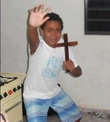 kid holding cross