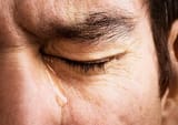 man-crying-close-up-of-eye-and-tear
