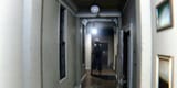p-t-lisa-stands-in-a-narrow-corridor