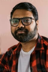 head-shot-portrait-smart-confident-smiling-millennial-indian-man-handsome-hindu-student-guy-freelancer-looking-at-camera-posing-for-photo