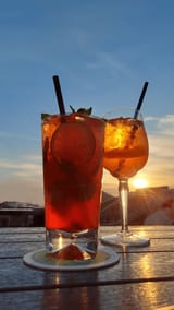 drinking-coctails-sunset-view-aperolspritz-600nw-2488235635