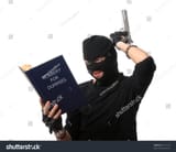 stock-photo-perplexed-robber-with-gun-reads-book-robbery-for-dummies-over-white-31151512