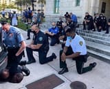 kneel white man