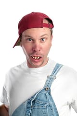 man-with-dumb-expression-and-bad-teeth-wearing-overalls