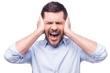 man covering eyes