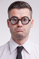 upset-disappointed-nerd-clerk-staring-camera-very-unhappy-42180486