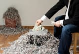 man-shredding-one-hundred-dollar-banknote