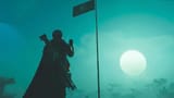 helldivers-2-player-saluting-the-flag-in-the-moonlight