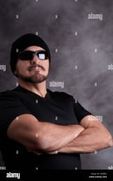 proud-tough-guy-in-black-strong-man-in-black-tee-shirt-sun-glasses-D03BX2