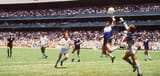 Diego-Maradona-of-Argentina-scores-The-Hand-of-God-past-England-goalkeeper-David-Seaman