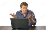10471559-Puzzled-man-at-computer-shrugs-shoulders-and-expresses-lack-of-knowledge-Stock-Photo
