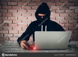 depositphotos_309657096-stock-photo-hacker-wearing-black-hooded-hacking