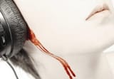 ears-bleeding-from-loud-headphones-413678993