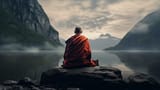 monks-in-meditation-tibetan-monk-from-behind-sitting-on-a-rock-near-the-water-among-misty-mountains-free-photo
