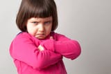 frustrated-young-child-sulking-with-crossed-arms-and-dirty-look
