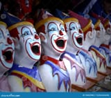 row-colourful-carnival-clown-heads-game-image-brightly-coloured-154322966[1]