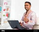 indian-man-computer-young-indian-people-using-laptop-computer-at-home-D8R5RR