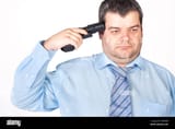 suicide-concept-man-pointing-a-gun-at-his-head-white-background-CWP4D8