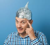 Man with aluminum foil hat very smart you see