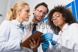 scientist taking notes