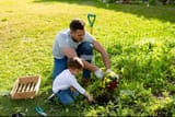 caucasian-father-and-son-gardening-together-2GN5T9T