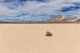 tumbleweed-dry-lake-bed-desert-mojave-cracked-mud-floor-blue-sky-clouds-mountains-racetrack-playa-death-53794477