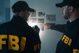 agents-at-work-exploring-photos-on-the-wall-during-investigation-picture-id1415766679-2395740332