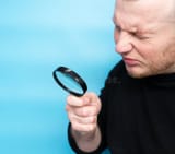 squinting-reading-text-magnifying-glass-young-man-has-poor-eyesight-guy-vision-rk-blue-269505538
